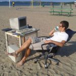 a.baa-With-computer-on-the-beach